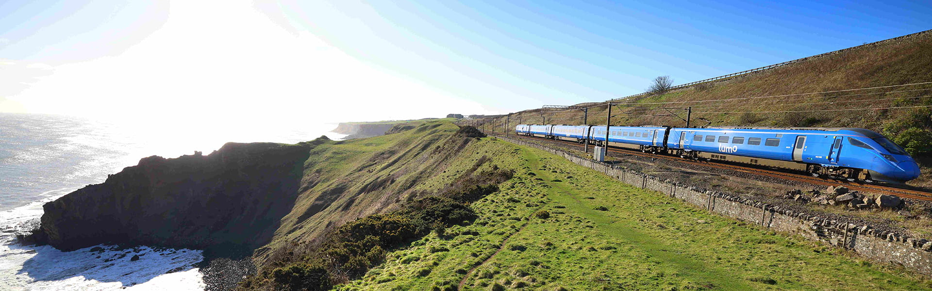 A Lumo train passing the coast