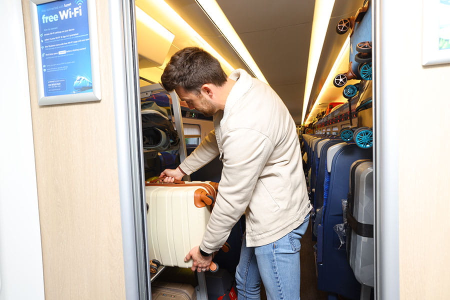 Customer storing suitcase