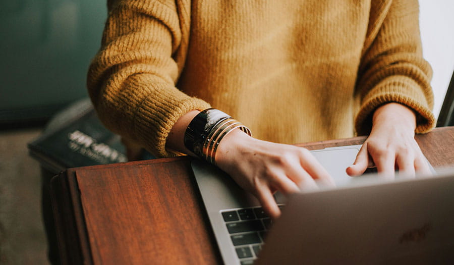 Person typing on a laptop