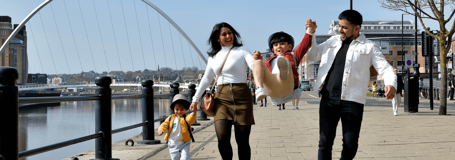 family playing in town centre