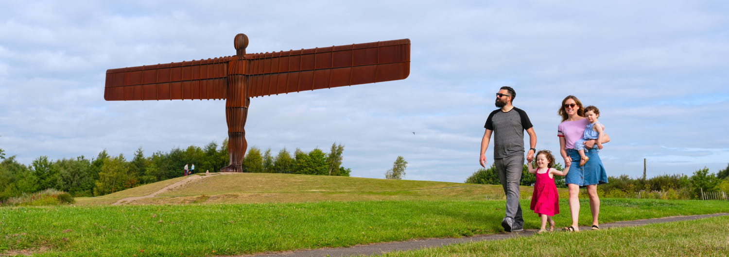 family walking in a field