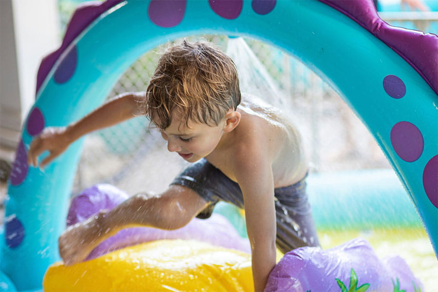 Child playing in water park