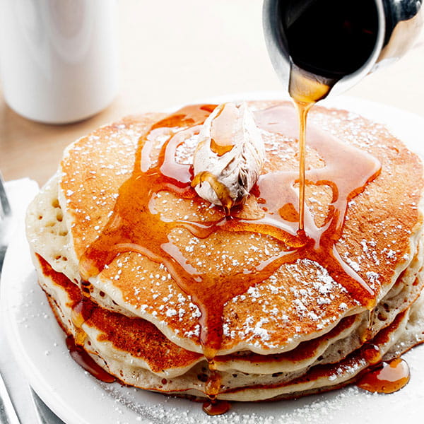 Stack of pancakes with maple syrup