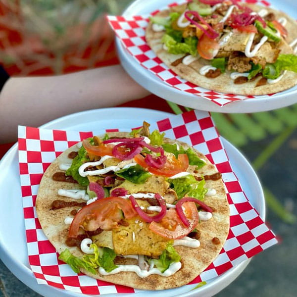 Two tacos on plates