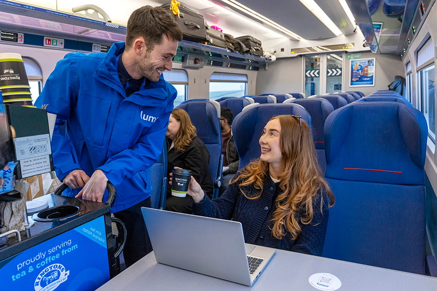 Lumo onboard ambassador delighting customer with free Ringtons tea