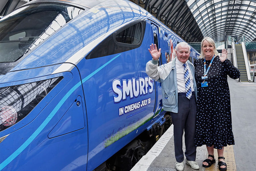 Charlie Barker and Lumo's Customer Experience Manager, Rachel Firth, next to a Lumo train