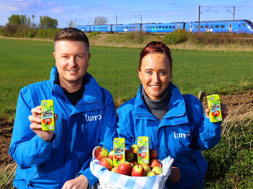 Two staff members showing flawsome drinks