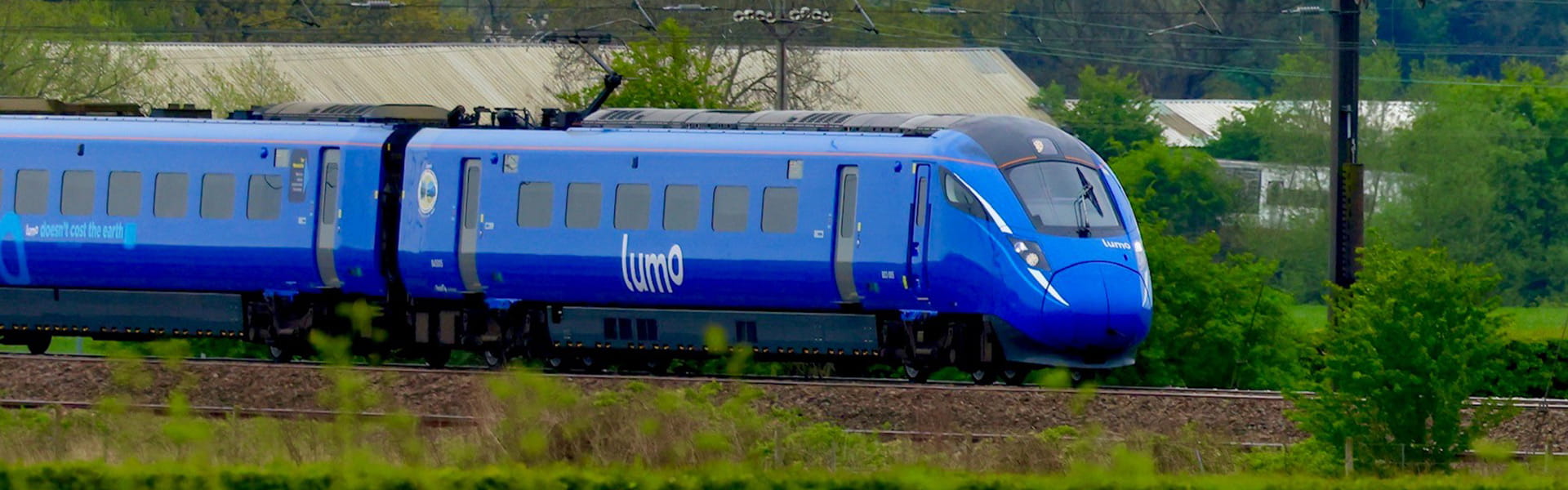 Lumo train going through the countryside