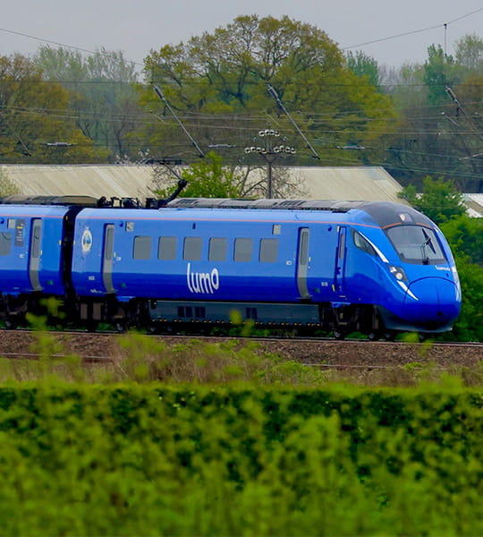 Lumo train going through the countryside